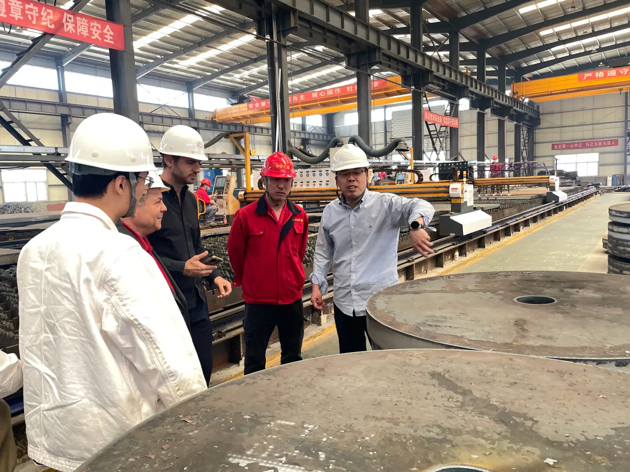 Buyer checking mill markings and heat numbers on steel plate