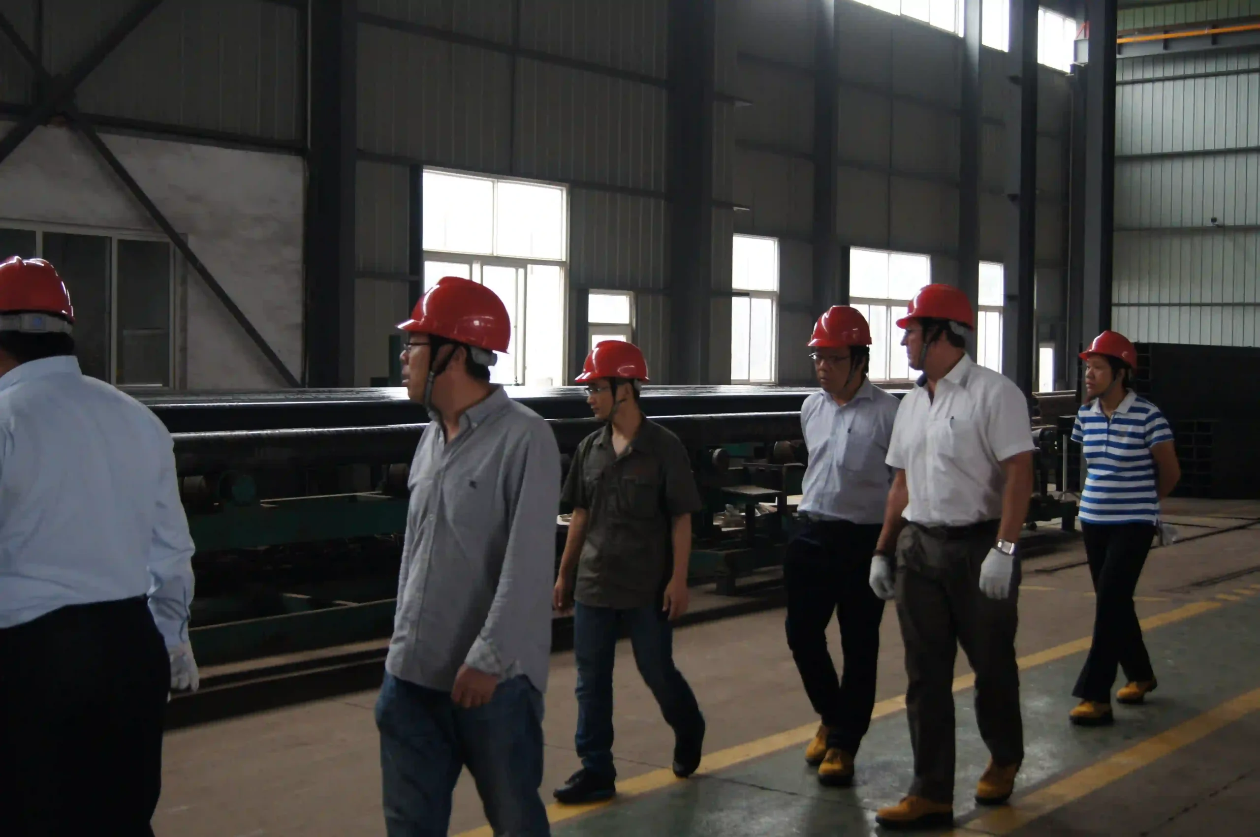 Overseas clients touring the heavy plate cutting workshop