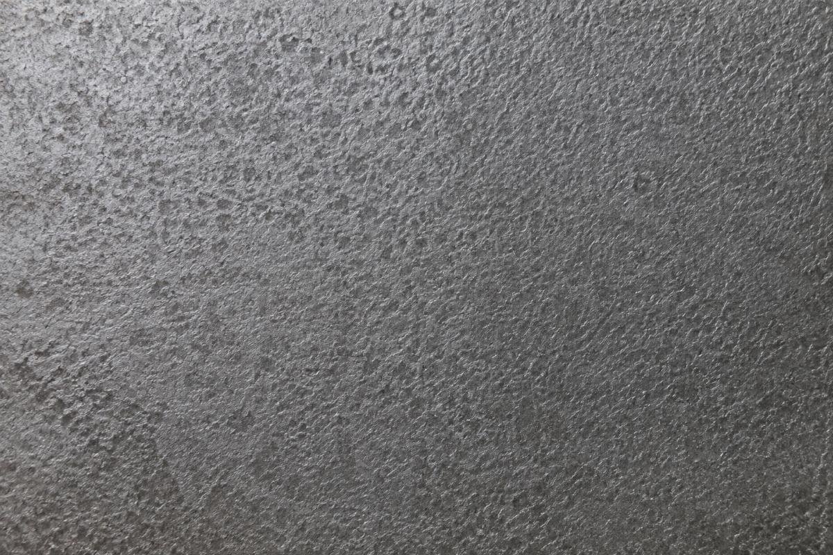 Close-up view of AR500 steel plate surface texture showing uniform hardness distribution for mining equipment