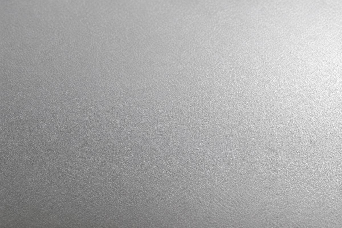 Close-up view of properly shot-blasted stainless steel plate surface showing uniform matte finish ready for export