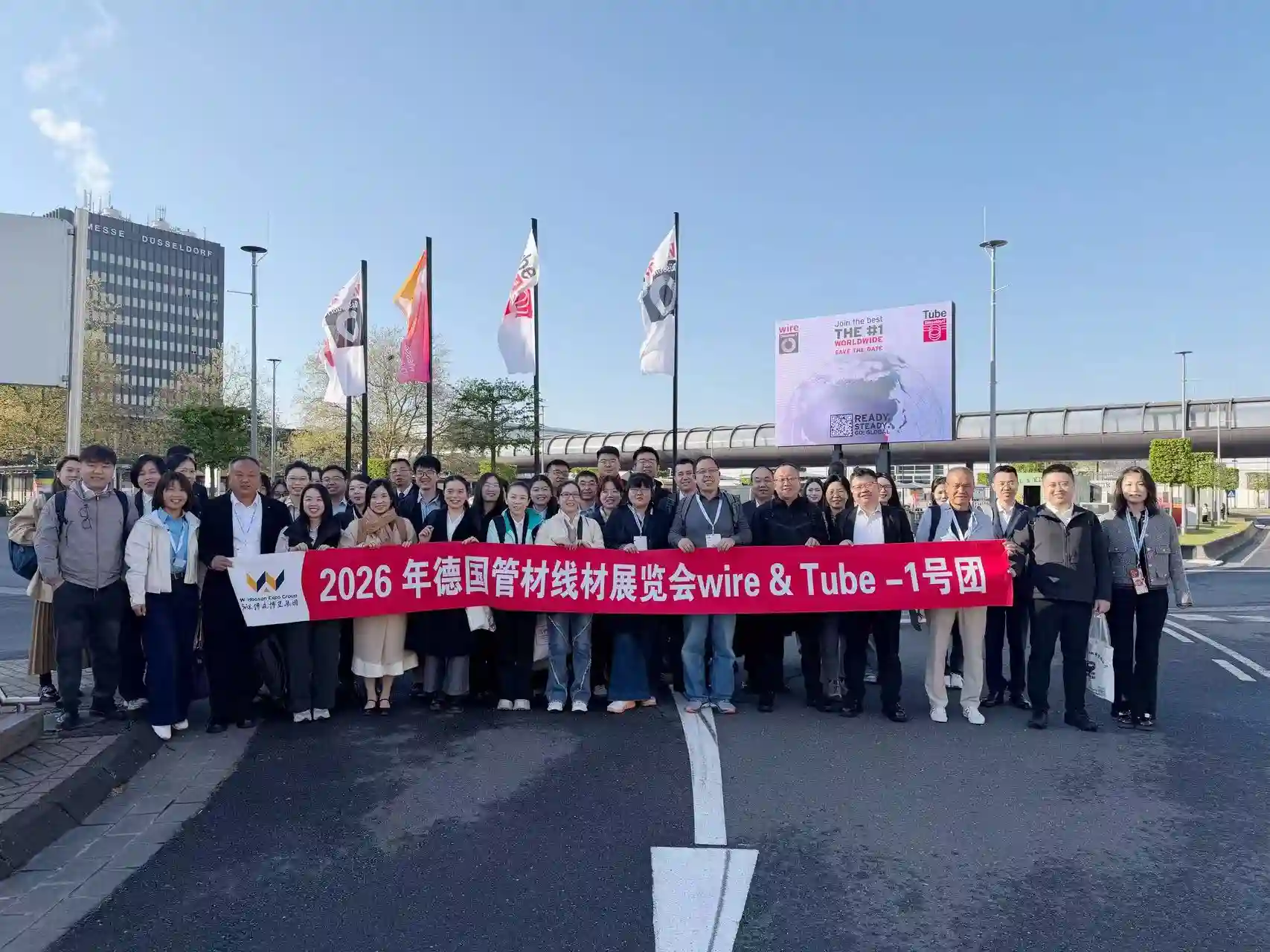 XJY Plate team at an international steel trade exhibition booth