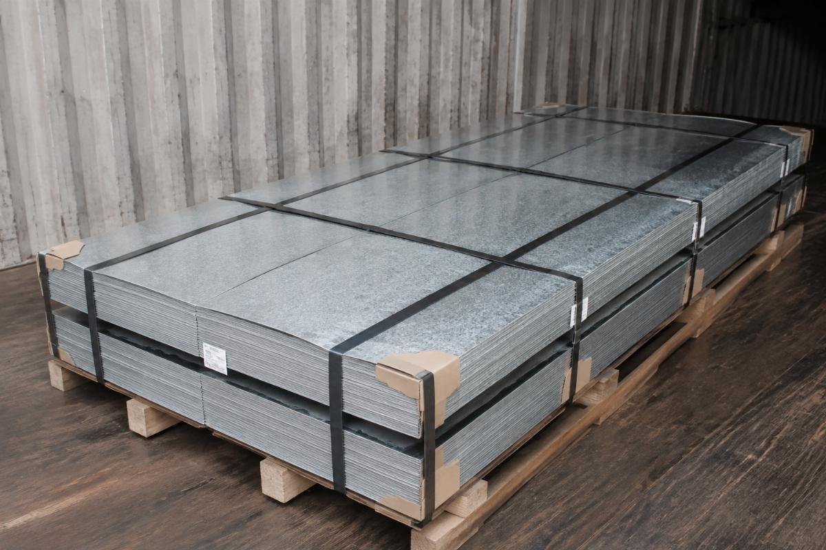 Stacked galvanized steel plates secured with steel straps and protective corner guards for sea freight